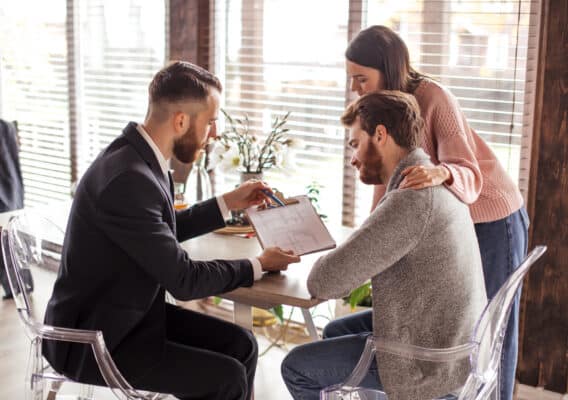 mortgage lender teaching couple about adjustable rate mortgages.